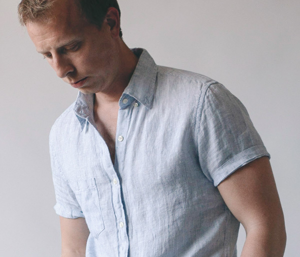 man wearing a button down short sleeve linen shirt