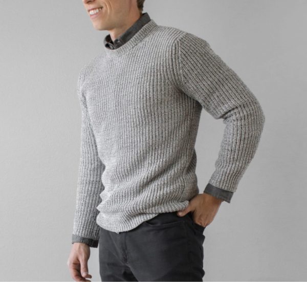 man wearing a grey shaker knit style sweater for primer magazine