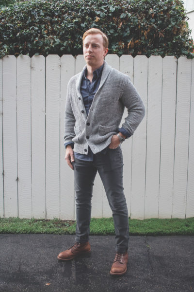 man wearing grey jeans and a grey cardigan for primer magazine