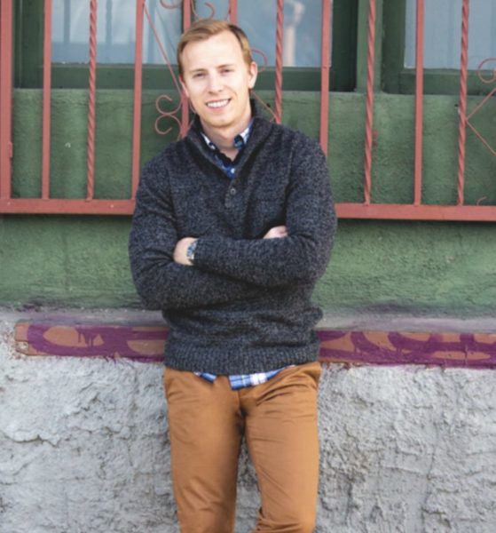andrew snavely from primer magazine wearing a navy blue sweater outfit