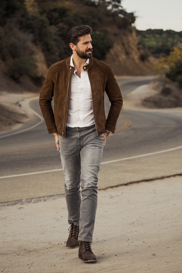 man wearing white dress shirt with leather jacket