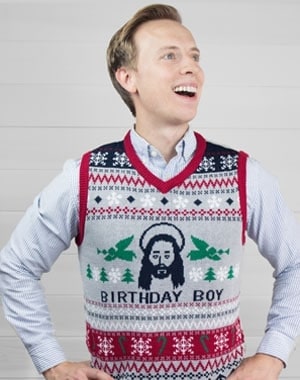 man wearing a humor themed holiday sweater vest for primer magazine