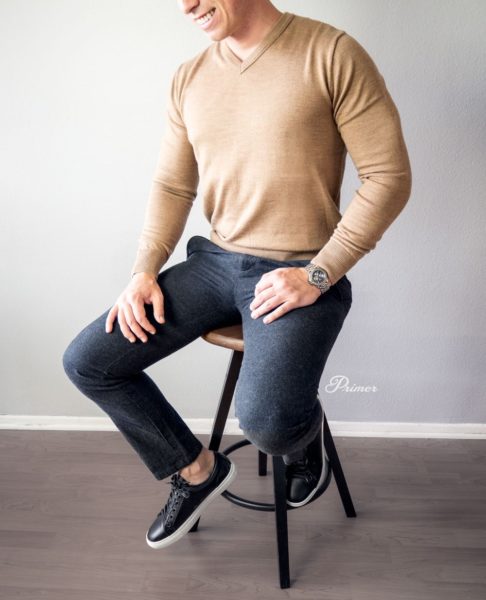 man wearing a v neck sweater for primer magazine