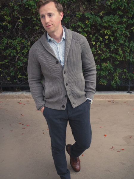 man wearing a grey buttoned cardigan for work style from primer magazine