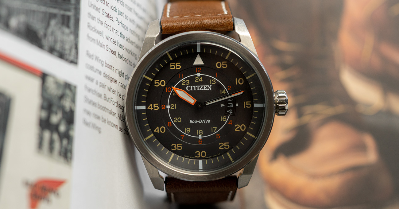 image of a watch with brown suede strap and black face from Citizen