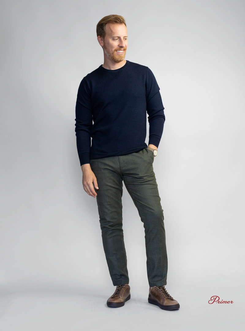 mens outfit with blue sweater green pants and brown sneakers