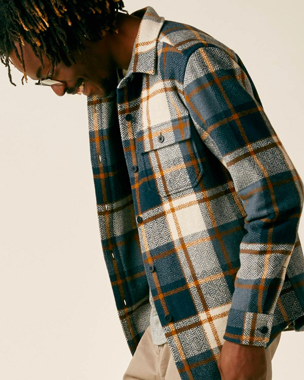 a man wearing a plaid jacket from Outerknown