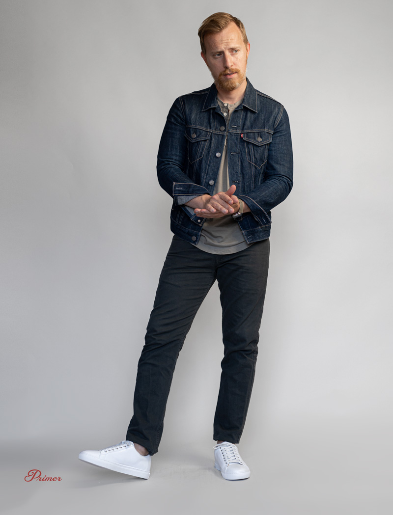 Smart casual with denim jacket, gray jeans, and white leather sneakers