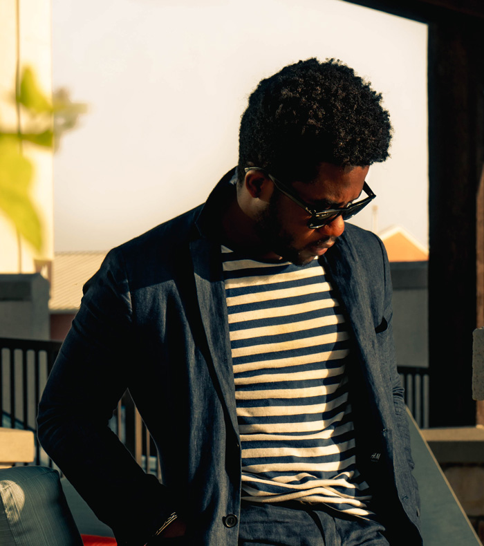 Man wearing a casual suit with a t-shirt