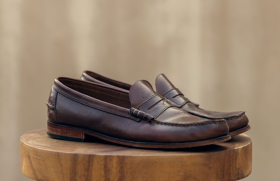 a pair of penny loafer shoes