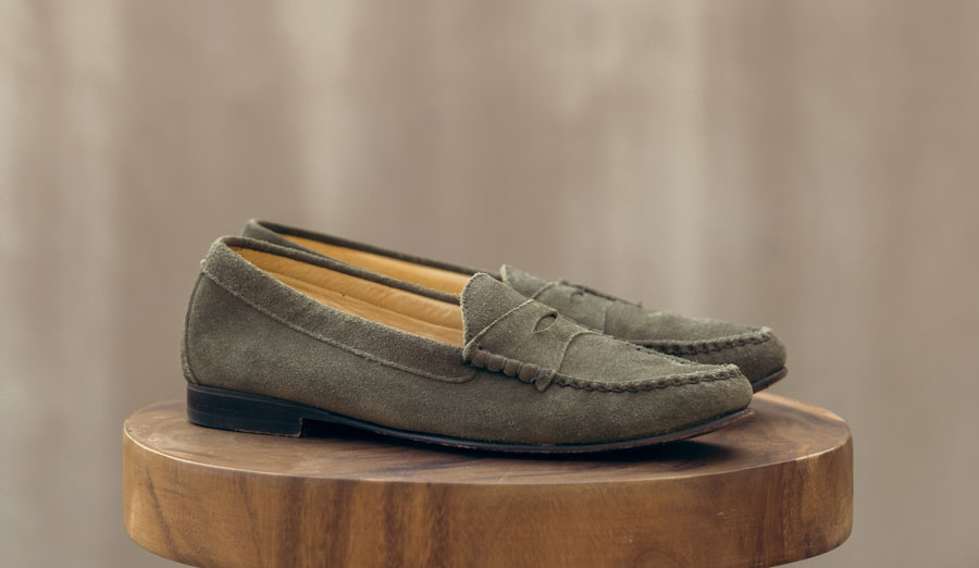 a pair of suede loafer shoes