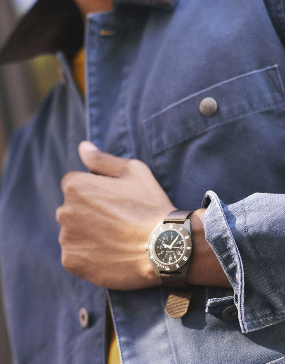 close up of a watch on a mans wrist