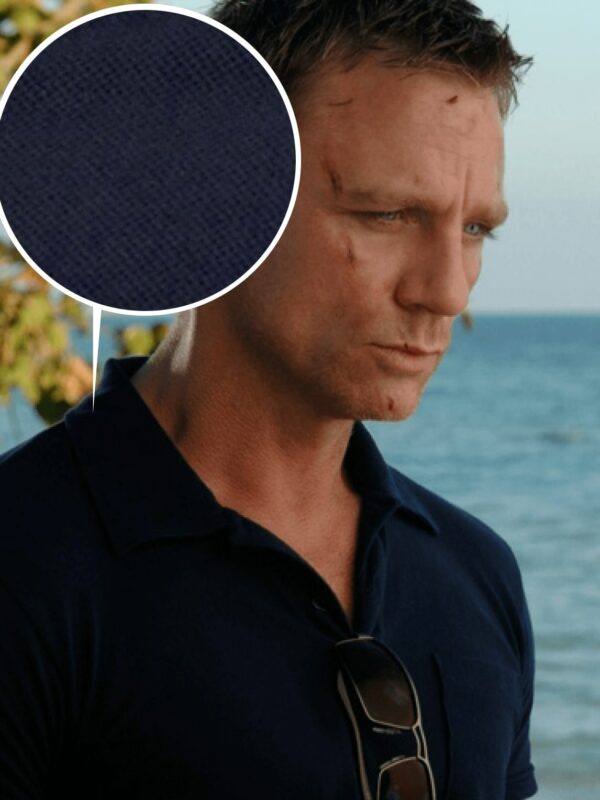 daniel craig james bond close up the the texture of a navy blue polo shirt