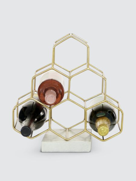 image of a gold honeycomb shaped wine rack with wine bottles in the rack