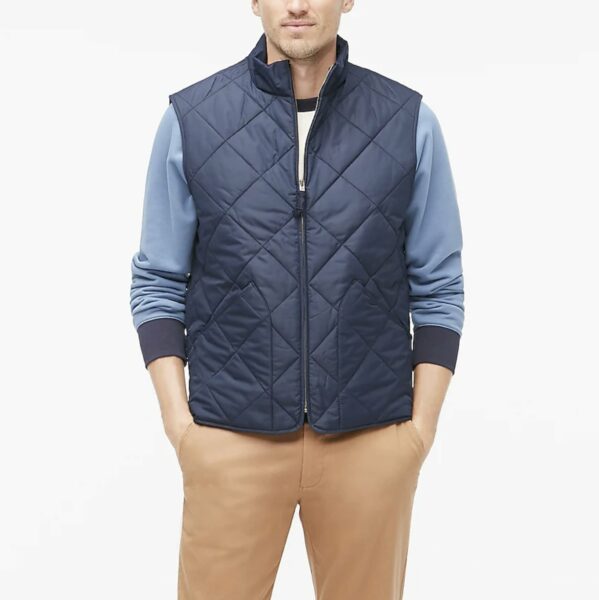 image of a man wearing a dark blue quilted vest
