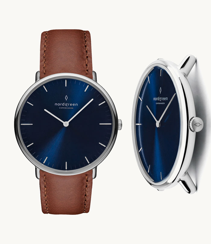 image of a watch with brown leather strap and blue face diel