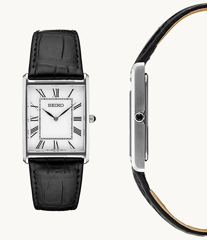 image of a seiko thin watch with black leather strap and white square shaped dial face