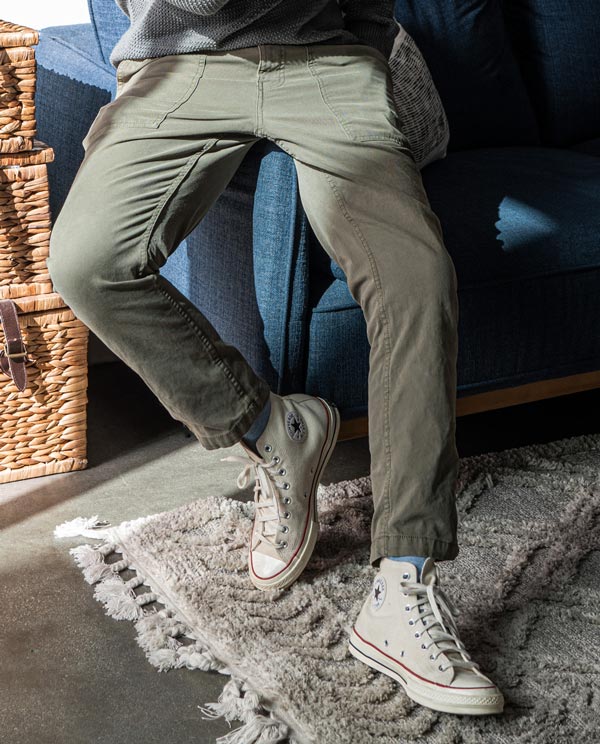 Green utility pants with Converse sneakers
