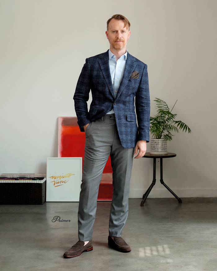 man in blue suit jacket with gray pants and brown loafers for wedding