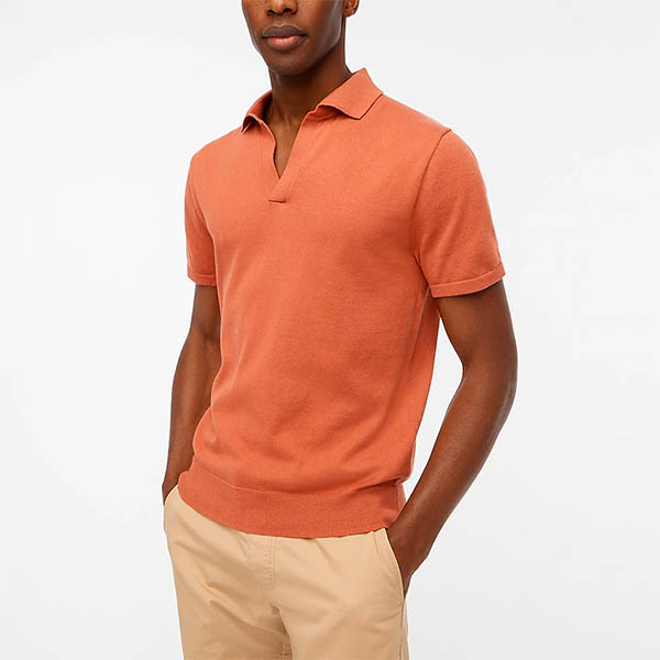 image of a pumpkin orange colored knit polo shirt