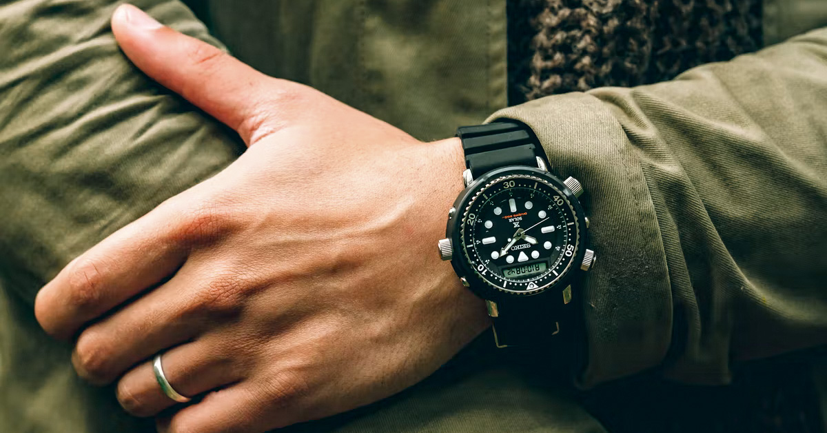 Close up of black watch on man's wrist