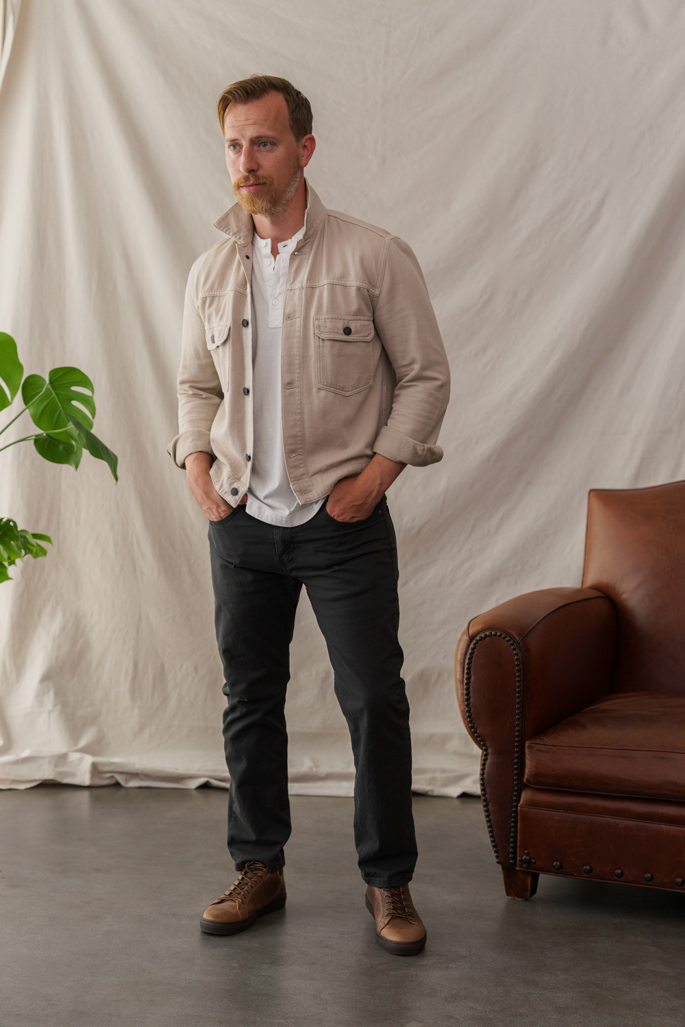 mens outfit with low top sneaker with trucker jacket and henley