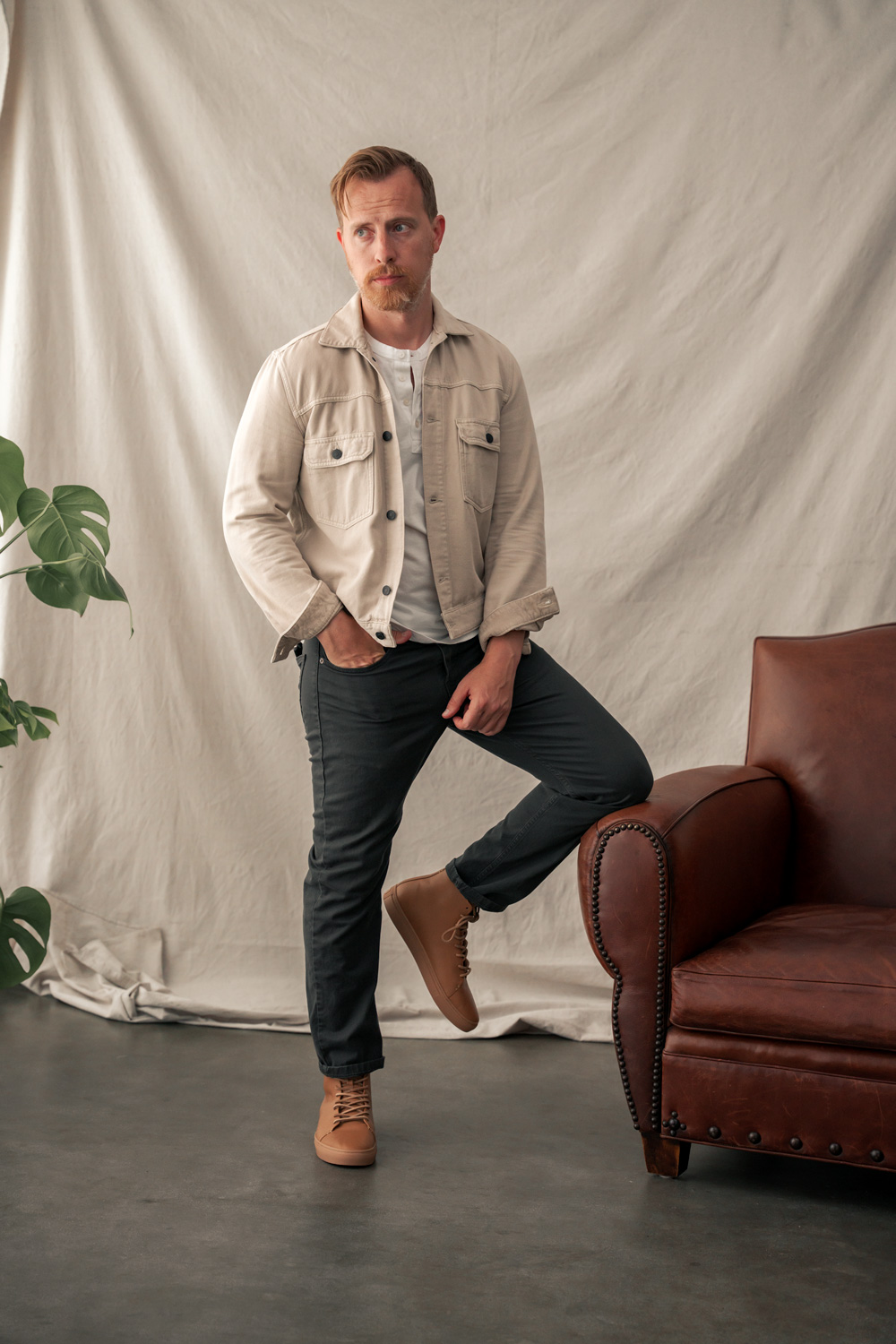 mens outfit with high top sneaker and trucker jacket and henley