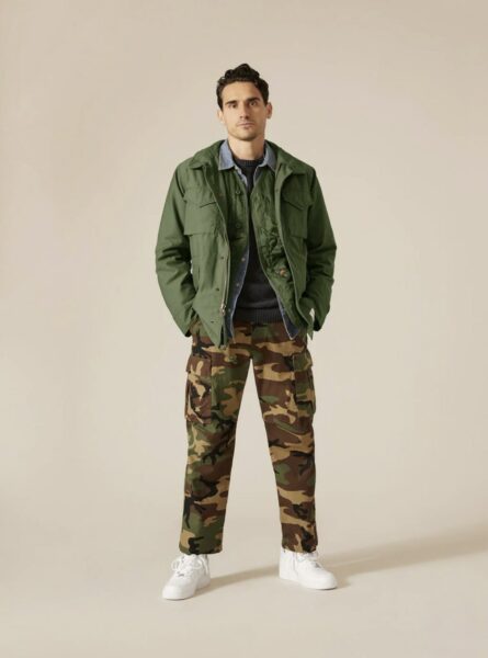 image of a man wearing camo print pants and a utility jacket