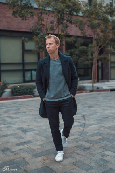 image of a man wearing black pants black coat and grey shirt