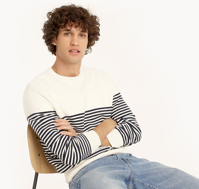 image of a man wearing a stripe crewneck sweater