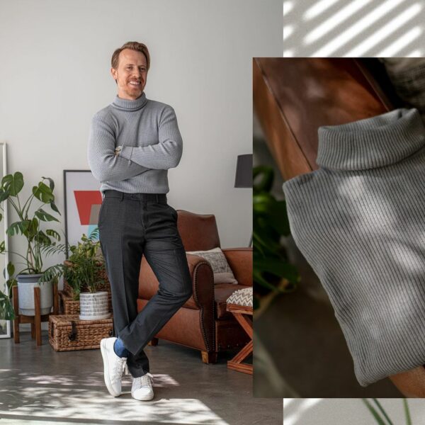 image of a man wearing a grey turtleneck sweater black pants white shoes