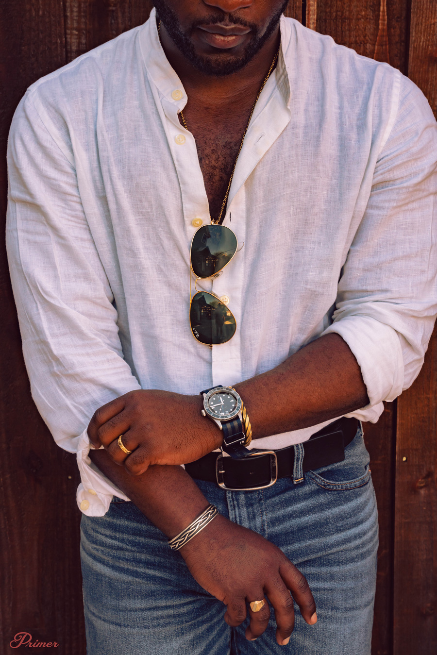 aviator sunglasses on a white linen shirt