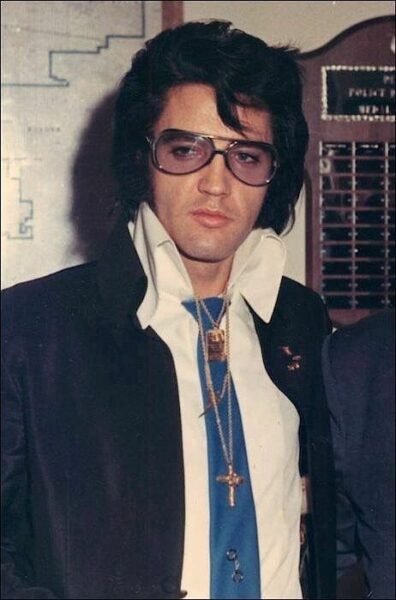 image of elvis presley wearing sunglasses and a collared shirt