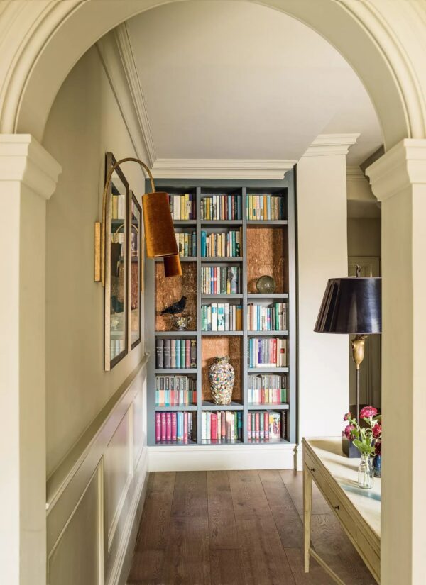 image of a hallway leading to shelves with books