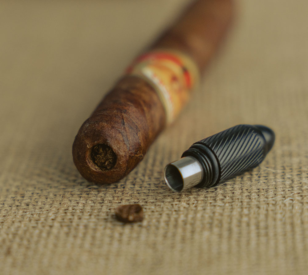 cut a cigar with cigar punch