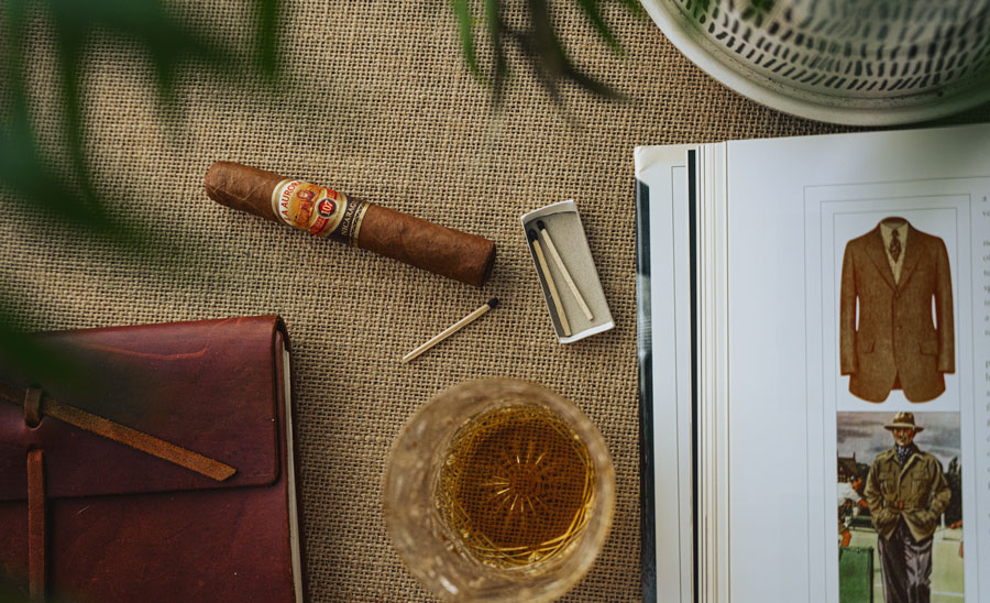 cigar with matches and book