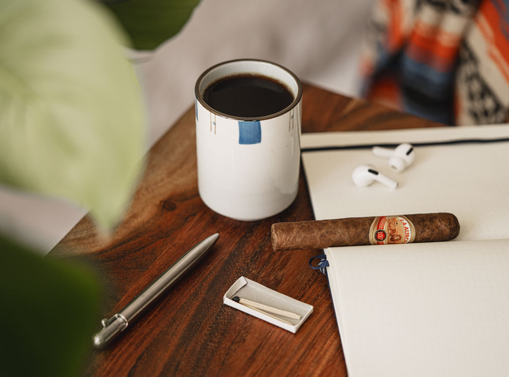 cigar with coffee and journal