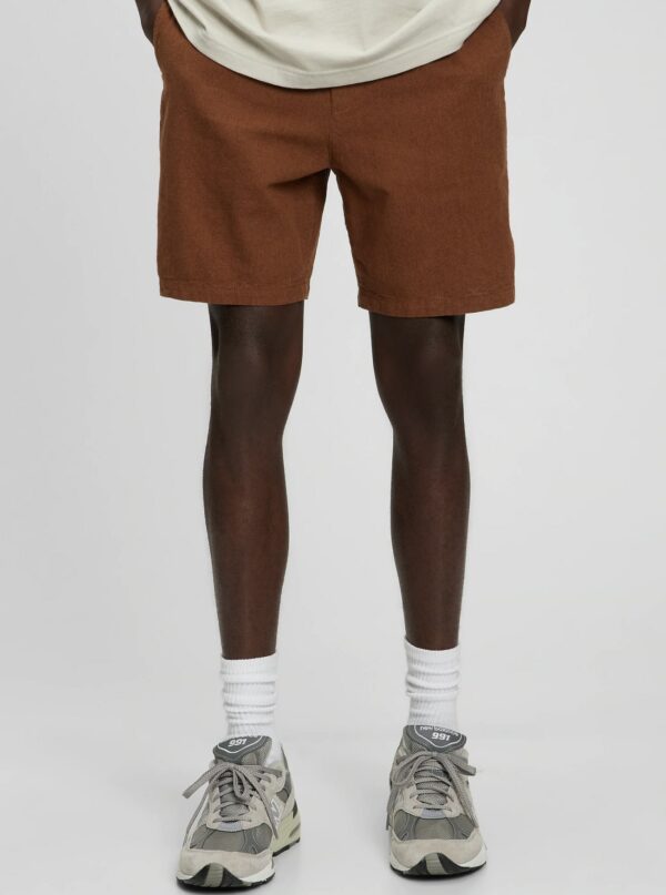 image of person wearing brown linen shorts