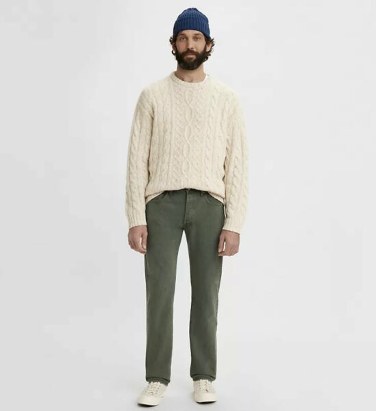 image of a man wearing green jeans and a white sweater