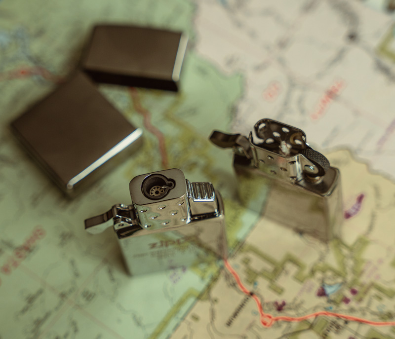 zippo butane insert next to traditional lighter