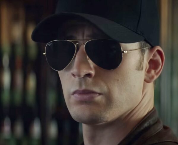 image of a man wearing dark aviator sunglasses and a ball cap