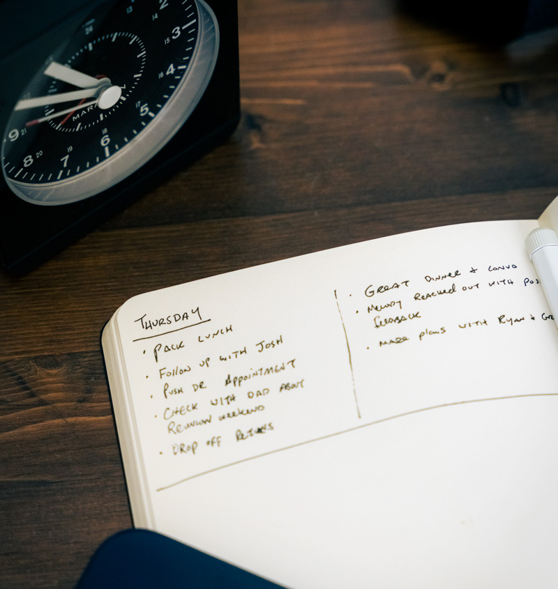 end of day journal on bedside table