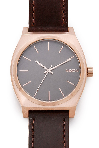 image of a watch with rose gold and brown leather details