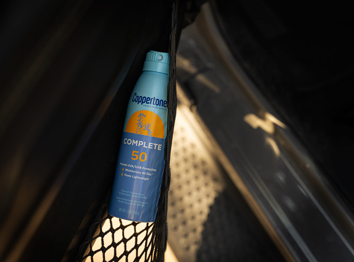 bottle of sunscreen in car door pocket
