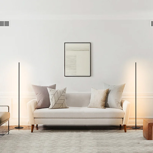 LED floor lamp in a living room with a white couch