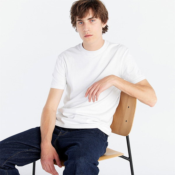 image of a man wearing a white shirt and dark jeans