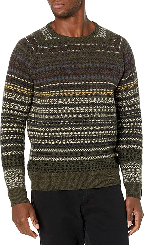 a man wearing a brown fair isle pattered sweater