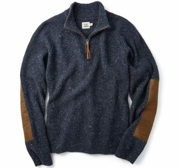 a dark blue quarter zip long sleeve shirt with waxed canvas elbow patches