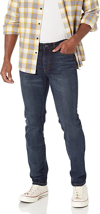 man wearing denim blue slim fit jeans