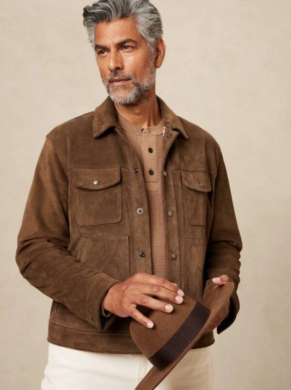 a man wearing a brown suede trucker jacket